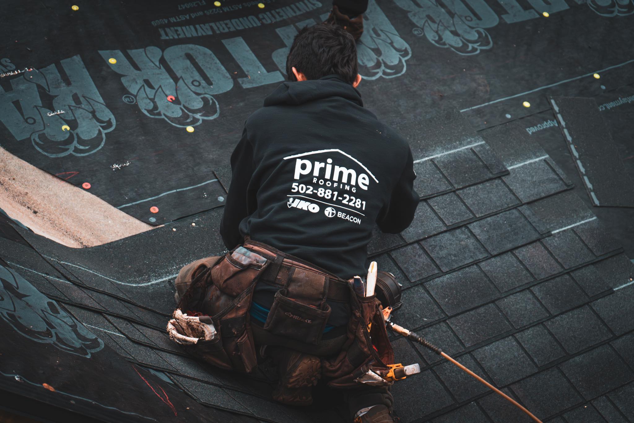Prime Roofing crew installing a new roof on a Kentucky home